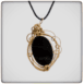 obsidian stone with bronze pendants