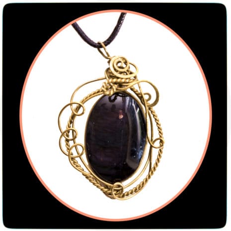 corded 11 feature obsidian stone with bronze pendants