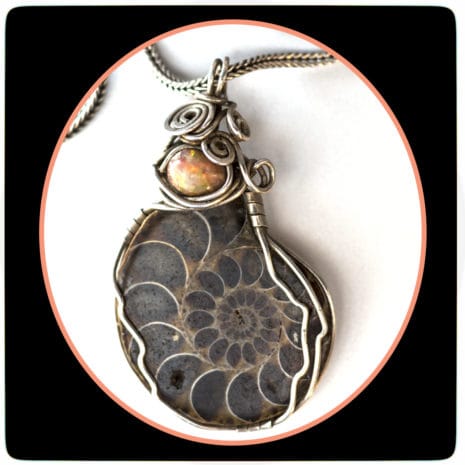 corded 32 feature fossil stone with silver pendants